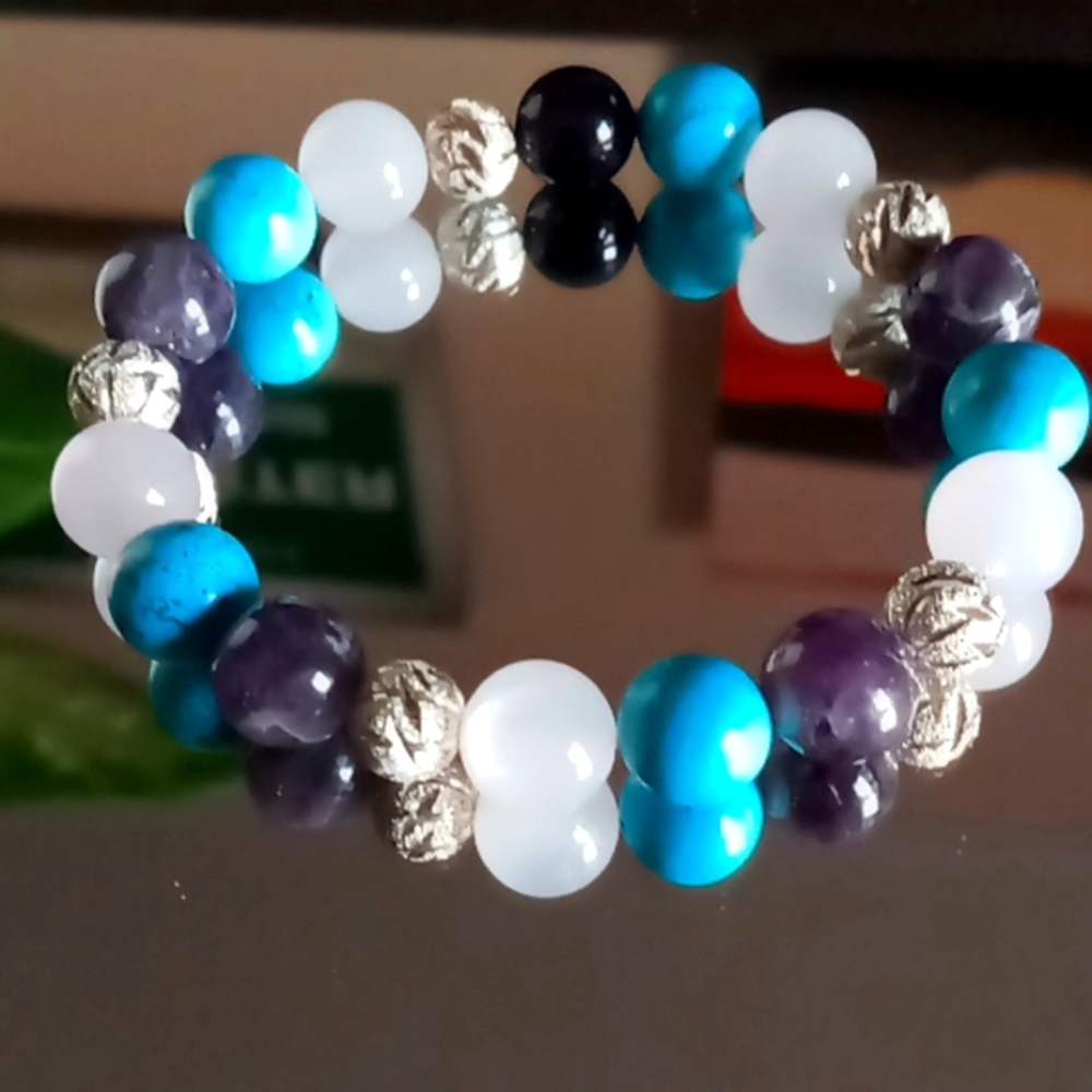 Genuine multi crystal bracet. with 925 sterling silver spacers.